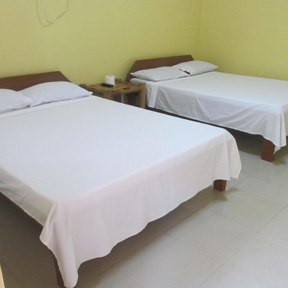 Alona Grove Tourist Inn Tawala  Bagian luar foto